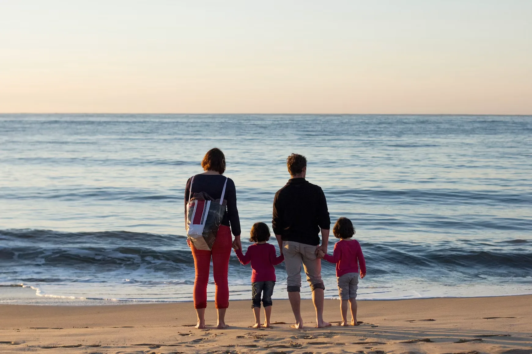 Parents and two children looking out to sea