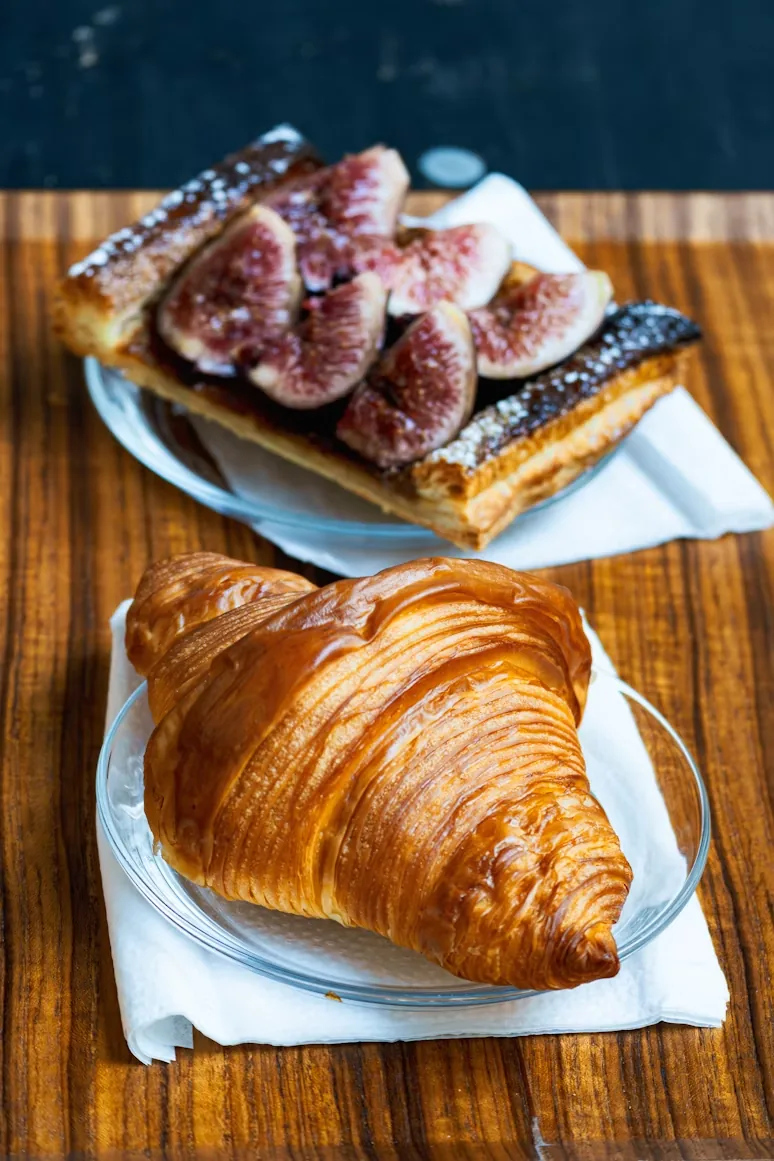 A croissant and fig tart in a Paris café