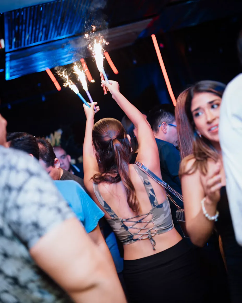 Sparklers lighting up a party at night